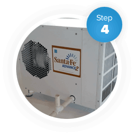 A white de-humidifier used to control moisture is used during a crawl space encapsulation.