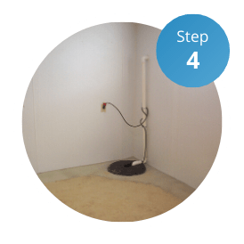 A sump pump and basin is installed with basement waterproofing services.