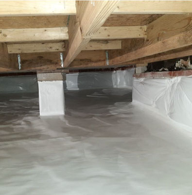 A crawl space with enhanced protection from basement waterproofing foundation repairs.