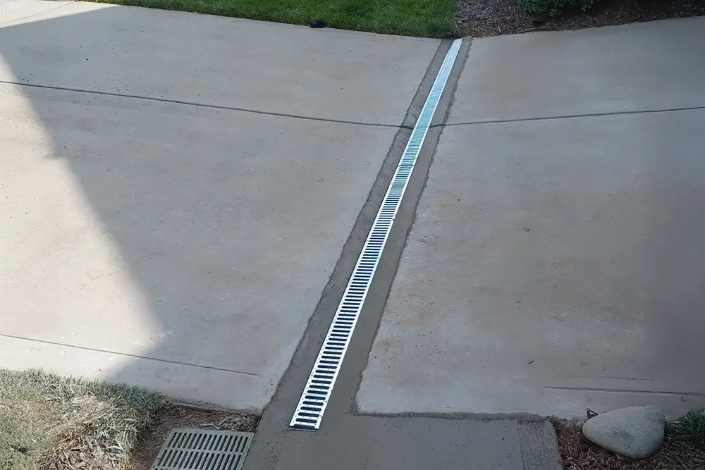 Channel Drain and Basin to remove excess water from driveway